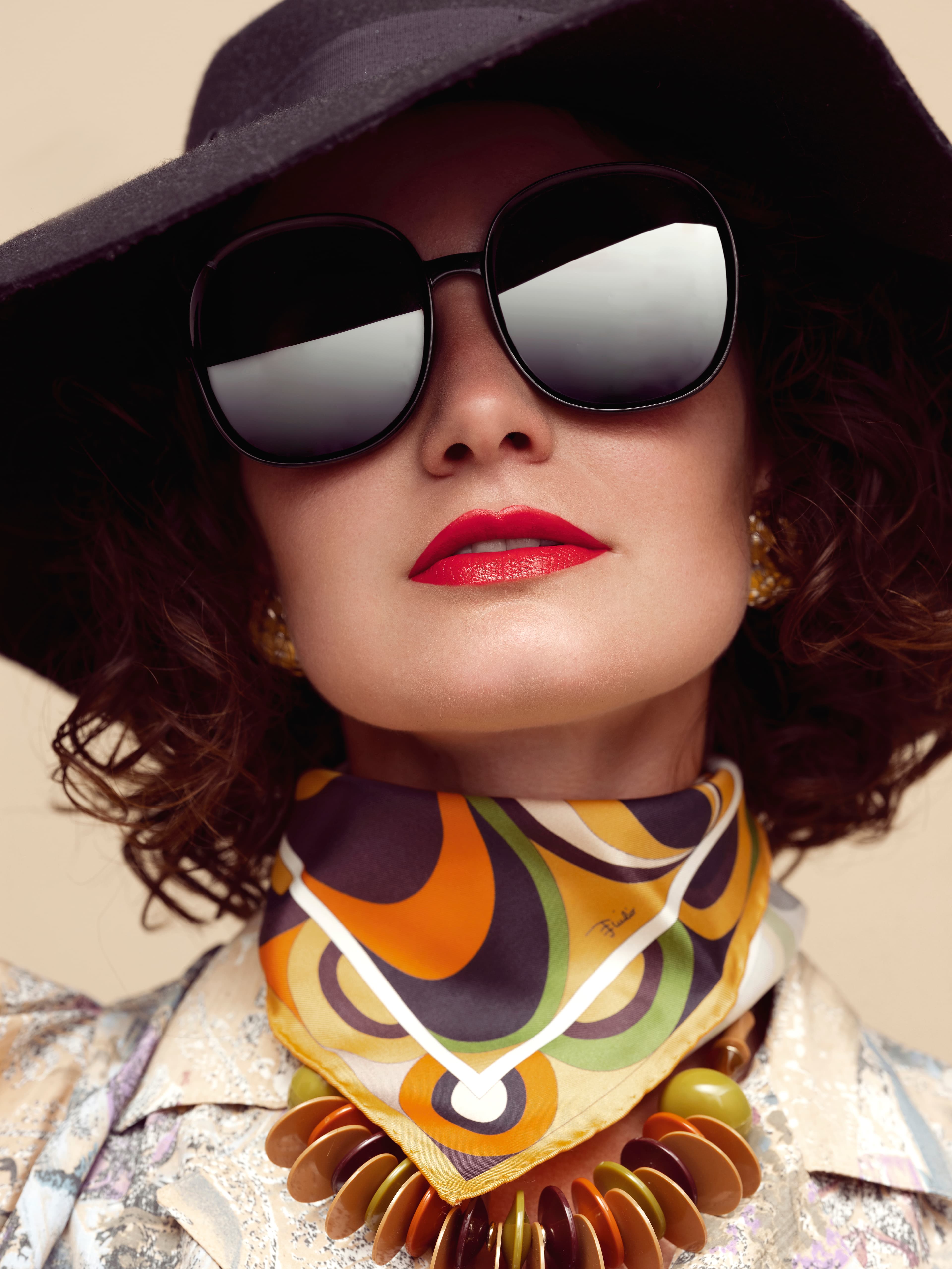 Images of a girl with glasses and a hat